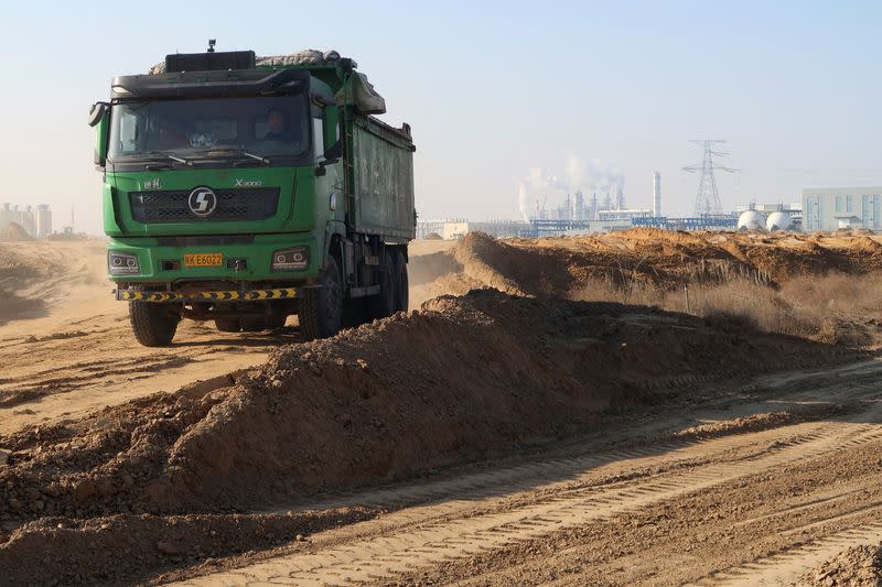 Truck drives at a construction site near Yuheng industrial area in Yulin