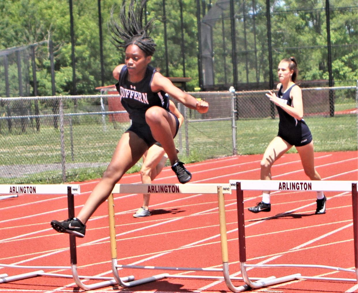 Suffern's Karen Augustin clears hurdle en route to winning the Section 1 Class AA girls 400-meter hurdles championship May 29, 2022 at Arlington High School.