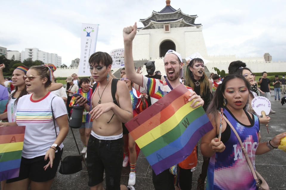 Participants march during the "Taiwan Pride March for the World!" at Liberty Square at the CKS Memorial Hall in Taipei, Taiwan, Sunday, June 28, 2020. This year marks the first Gay Pride march in Chicago 1970, and due to the COVID-19 lockdown, Taiwan is one of the very few countries to host the world's only physical Gay Pride. (AP Photo/Chiang Ying-ying)