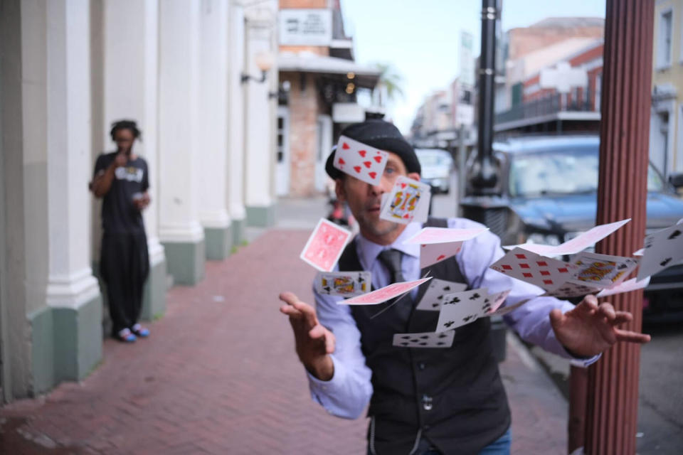 Man throwing playing cards in the air (Alex Seitz-Wald / NBC News)