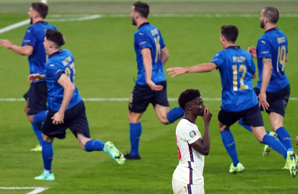 England's Bukayo Saka stands dejected after missing during the penalty shoot out following the UEFA Euro 2020 Final at Wembley Stadium, London. Picture date: Sunday July 11, 2021. (Photo by Mike Egerton/PA Images via Getty Images)