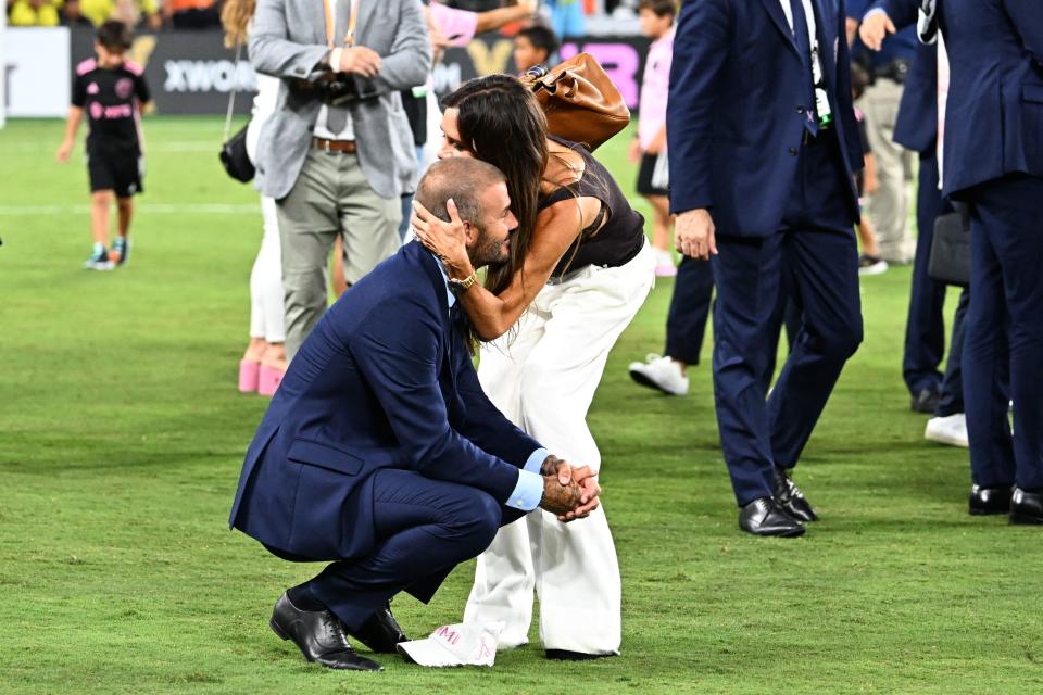 TOPSHOT - Inter Miami's co-owner David Beckham is hugged by wife English fashion designer Victoria Beckham after Inter Miami won the Leagues Cup final football match against Nashville SC at Geodis Park in Nashville, Tennessee, on August 19, 2023. (Photo by CHANDAN KHANNA / AFP) (Photo by CHANDAN KHANNA/AFP via Getty Images)