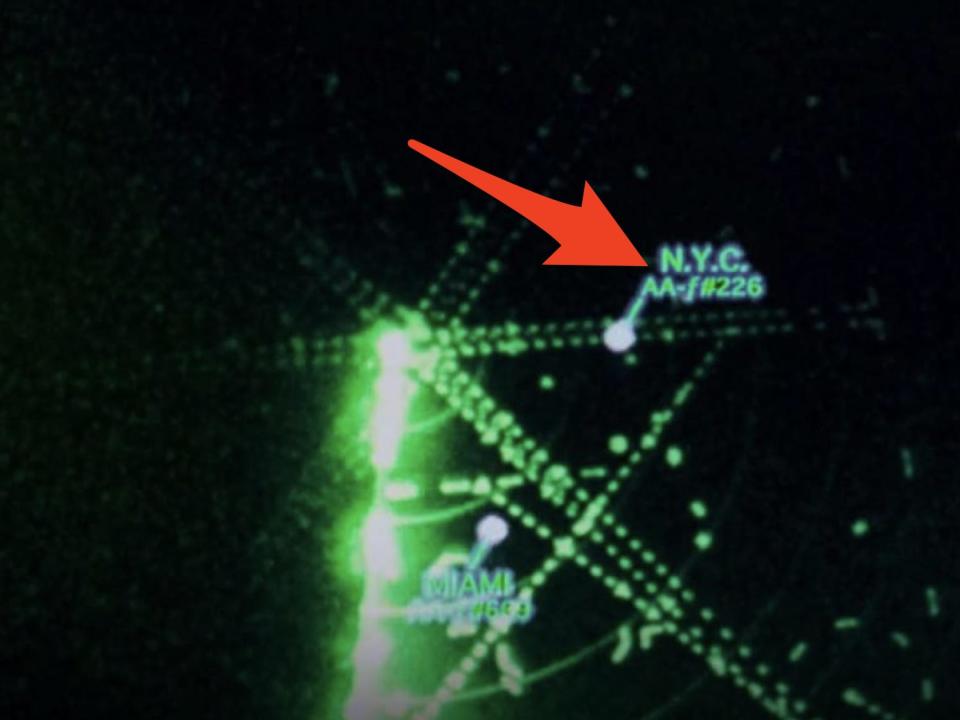 red arrow pointing at kevin's new york flight number on a tracking screen