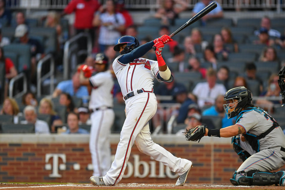 ATLANTA, GA  AUGUST 21:  Atlanta Braves infielder Adeiny Hechavarria (24) hits a home run during the MLB game between the Miami Marlins and the Atlanta Braves on August 21st, 2019 at SunTrust Park in Atlanta, GA. (Photo by Rich von Biberstein/Icon Sportswire via Getty Images)