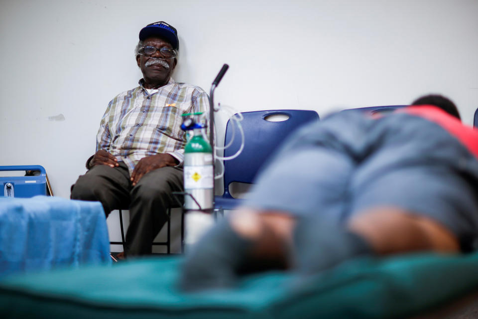 A man using a respiratory machine sits in a shelter run by the Red Cross in Grantsboro, North Carolina, on Sept. 13, 2018. (Photo: Eduardo Munoz / Reuters)