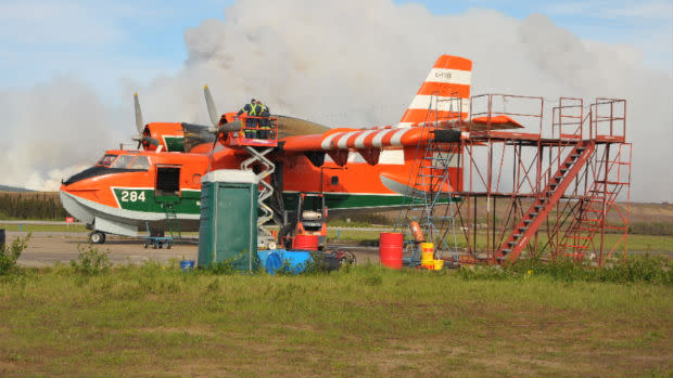 A water bomber used in the fight against the fires outside Wabush is seen refuelling last week at an airstrip. 