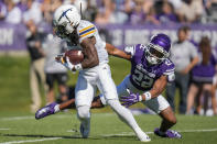 UTEP wide receiver Tyrin Smith, left, avoids a tackle by Northwestern defensive back Evan Smith during the first half of an NCAA college football game Saturday, Sept. 9, 2023, in Evanston, Ill. (AP Photo/Erin Hooley)