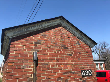 Paint -- which was found to contain 16 per cent lead -- peels from an abandoned switch house in Fort Knox, Kentucky, U.S. April 12, 2018. REUTERS/Joshua Schneyer