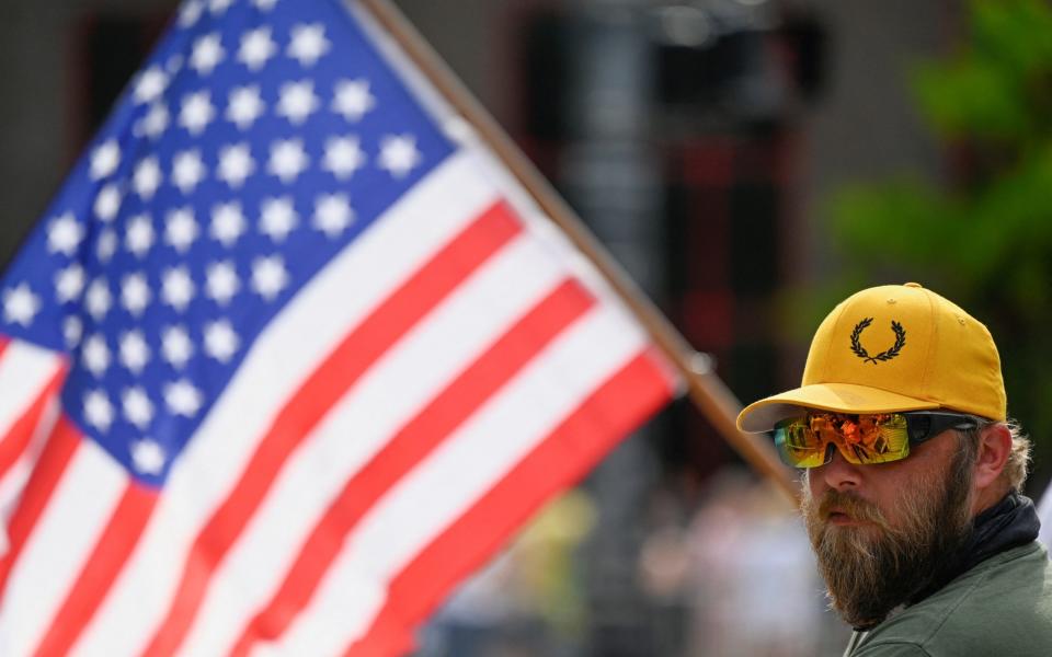 A member of the far-Right Proud Boys group outside the arena in Grand Rapids on Saturday