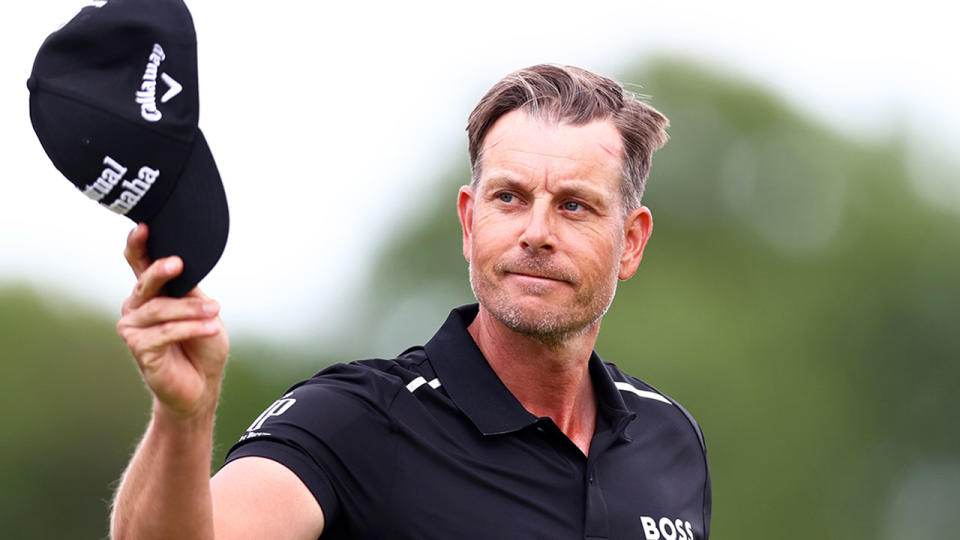 Pictured here, Henrik Stenson salutes fans during a golf tournament in 2022.