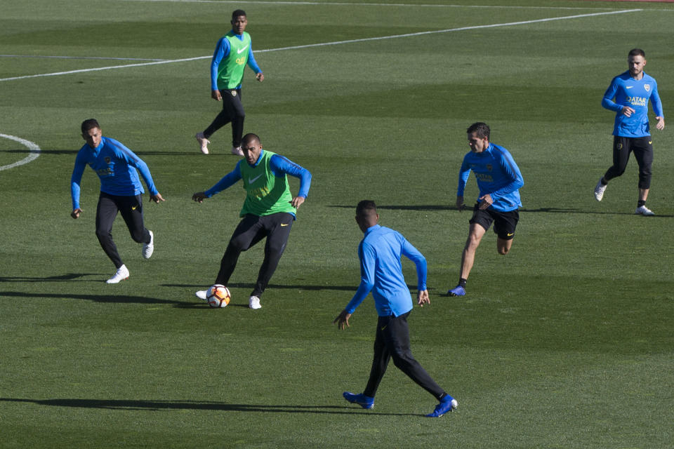 Boca Junior players play a match between themselves during a training session in Madrid, Spain, Thursday, Dec. 6, 2018. The Copa Libertadores Final will be played on Dec. 9 in Spain at Real Madrid's stadium for security reasons after River Plate fans attacked the Boca Junior team bus heading into the Buenos Aires stadium for the meeting of Argentina's fiercest soccer rivals last Saturday. (AP Photo/Paul White)