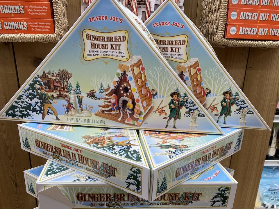 stack of triangular boxes of gingerbread house kits at trader joe's