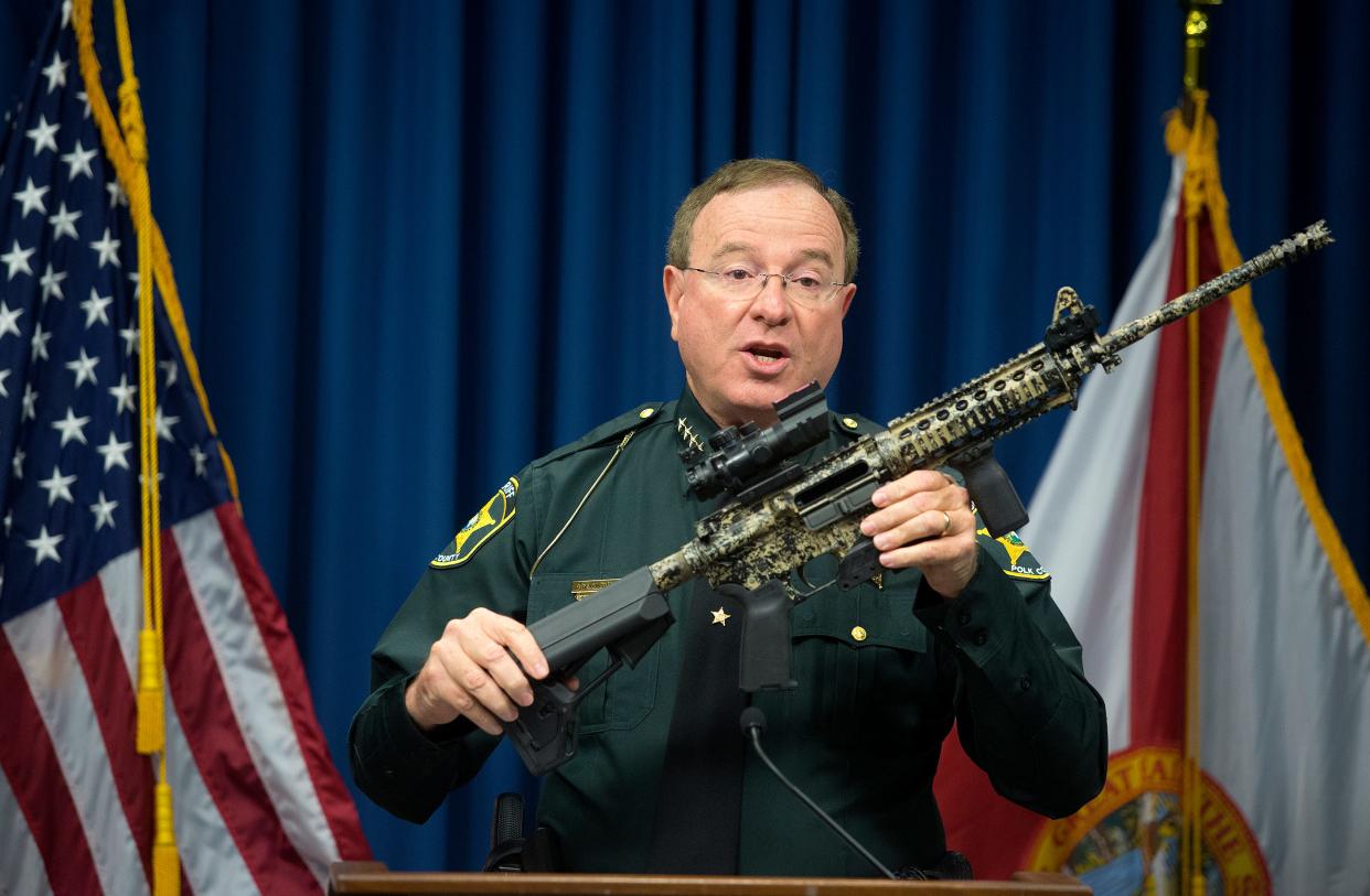 Polk County Sheriff Grady Judd holds up an AR-15 during a press conference, one of several weapons confiscated along with 6.7 pounds of methamphetamine ICE worth approximately $300,000. The Sheriff's Office also arrested six suspects during the investigation Operation Numero Dos in Winter Haven  on Dec. 22, 2016.