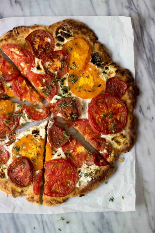 <p>The Healthy Epicurean</p><p>A party-worth vegetarian pizza with a crispy crust, Boursin cheese, heirloom tomatoes and fresh herbs.</p><p><strong>Get the recipe: <a href="https://thehealthyepicurean.com/rustic-heirloom-tomato-pizza" rel="nofollow noopener" target="_blank" data-ylk="slk:Rustic Heirloom Tomato Pizza;elm:context_link;itc:0;sec:content-canvas" class="link ">Rustic Heirloom Tomato Pizza</a></strong></p>
