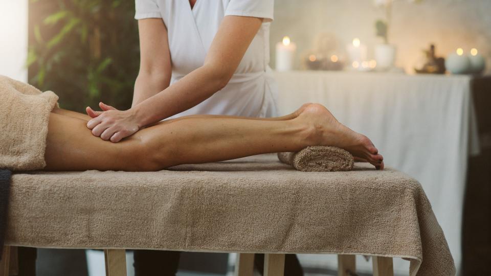 Mid adult woman on anti cellulite massage in beauty salon.