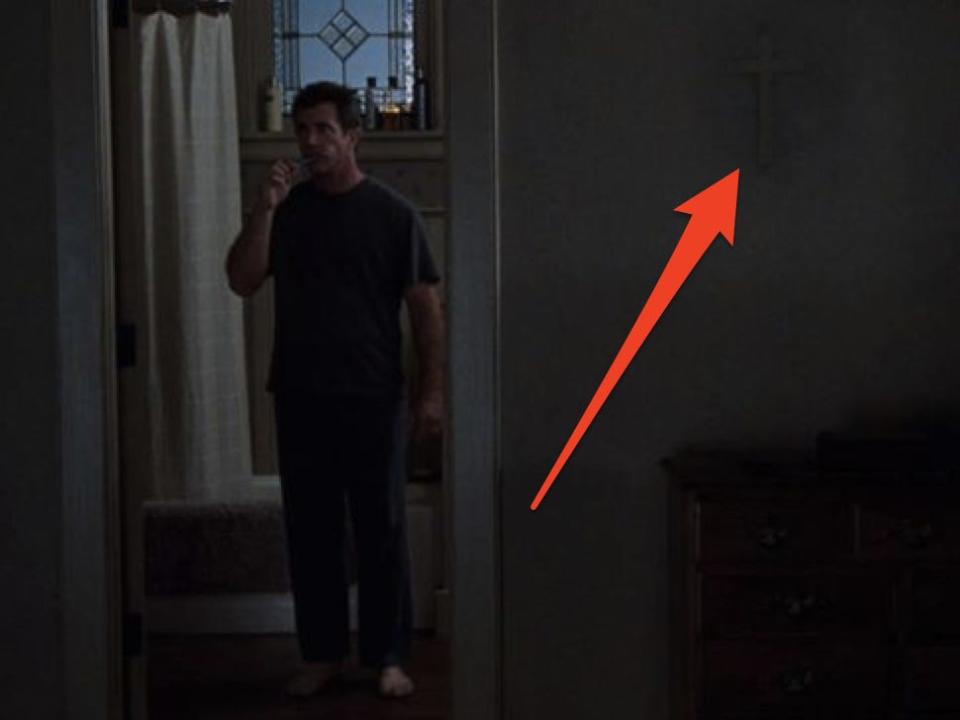 A missing cross can be seen on the wall in "Signs" while main character brushes teeth in the bathroom