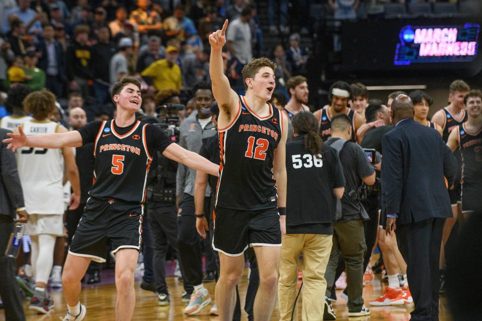 Princeton guard Ryan Langborg (3) and forward Caden Pierce (12) celebrate the team's win over Missouri in a second-round college basketball game in the men's NCAA Tournament in Sacramento, Calif., Saturday, March 18, 2023. Princeton won 78-63.