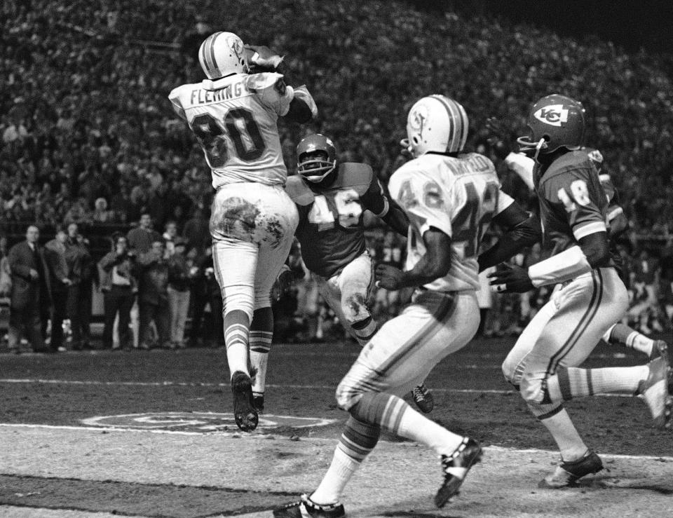 The Miami Dolphins' Marv Fleming catches a pass from Bob Griese against the Kansas City Chiefs in the 1971 AFC divisional playoff game played on Christmas Day.