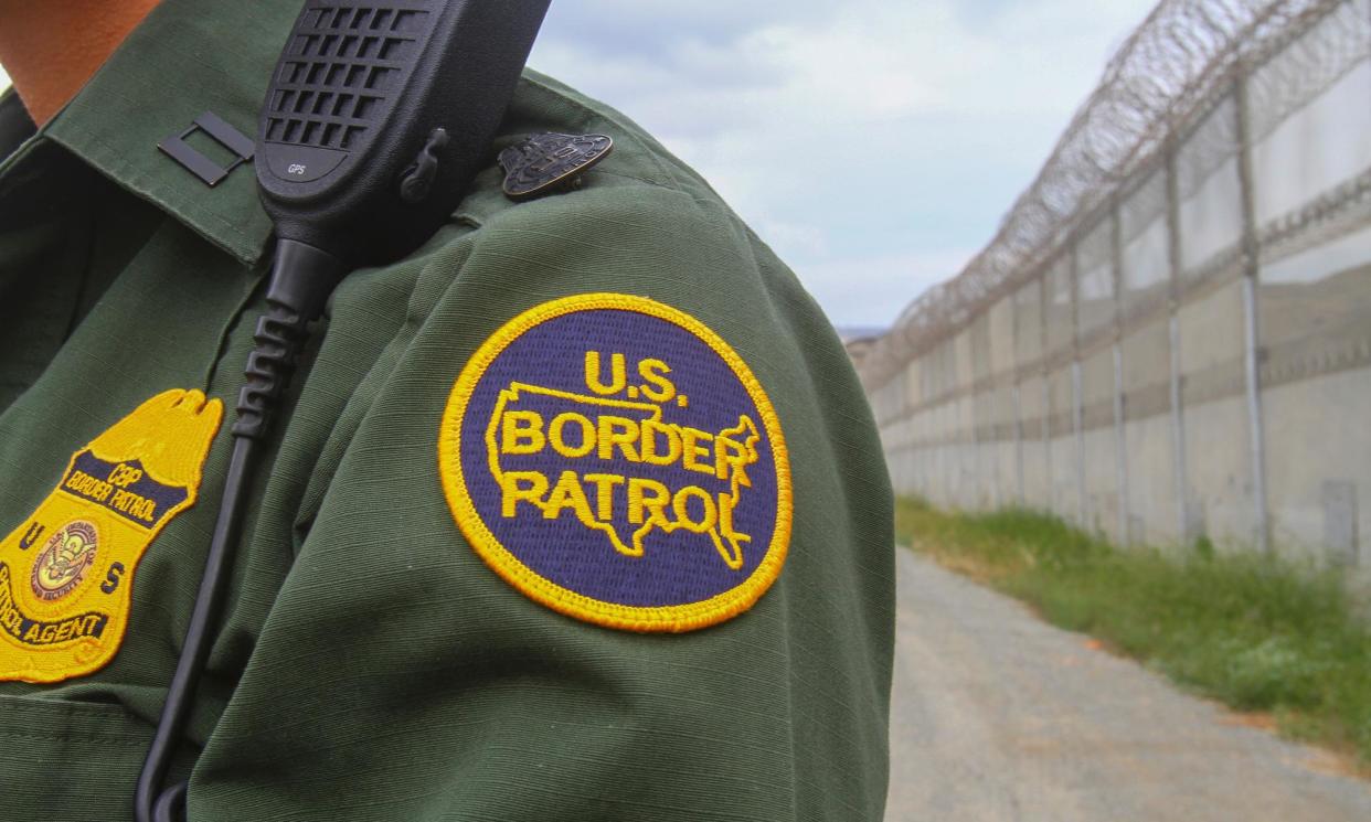 <span>A border patrol agent at the US-Mexico border on 17 May 2016, in San Diego, California.</span><span>Photograph: Bill Wechter/AFP/Getty Images</span>