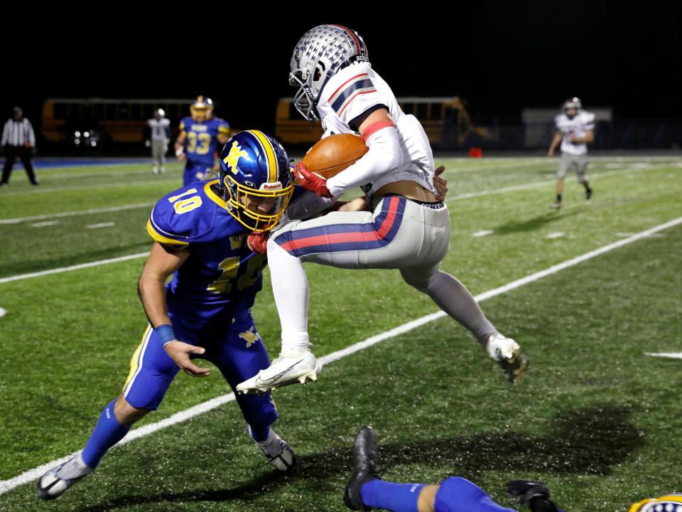 Carter Winland, of West Muskingum, tries to tackle Morgan's Mason Burnside runs on Oct. 7, 2022, during the Tornadoes' 26-20 win in Falls Township. Winland is the team's top returning tackler to a veteran defense in 2023.