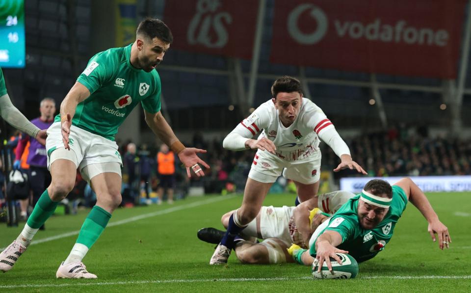 Rob Herring scores a try against England - Getty Images/David Rogers