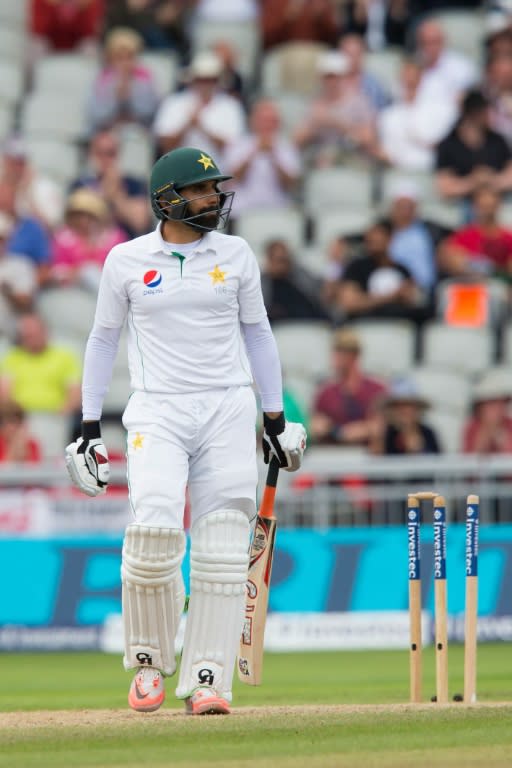 Pakistan's captain Misbah-ul-Haq leaves the field after losing his wicket for 35 runs, on the 4th day of their 2nd Test match against England, at the Old Trafford Cricket Ground in Manchester, on July 25, 2016