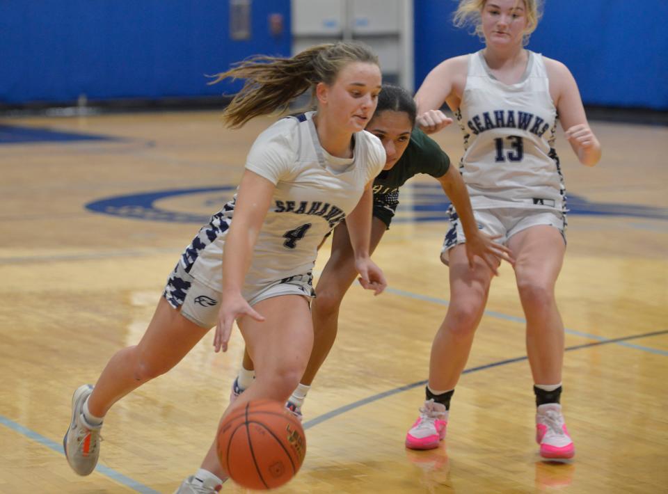 Cape Cod Academy's Lili Shanahan, left, moves past D-Y's Jaylene Pires as she heads for the basket in third quarter action.