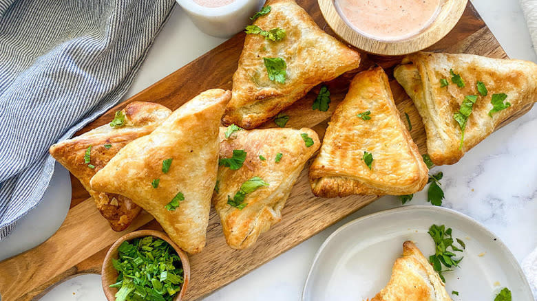 samosas on wooden board