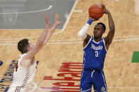 Drake's D.J. Wilkins (0) shoots over Loyola of Chicago's Tate Hall during the first half of the championship game in the NCAA Missouri Valley Conference men's basketball tournament Sunday, March 7, 2021, in St. Louis. (AP Photo/Jeff Roberson)