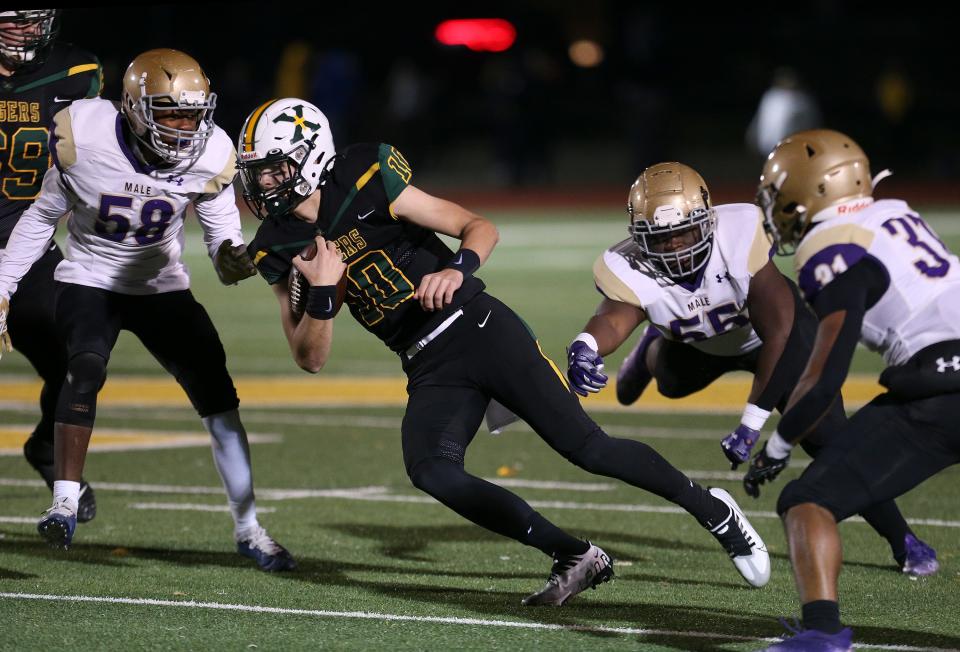 St. X's Trevor Havill gains some yardage in a game against Male.