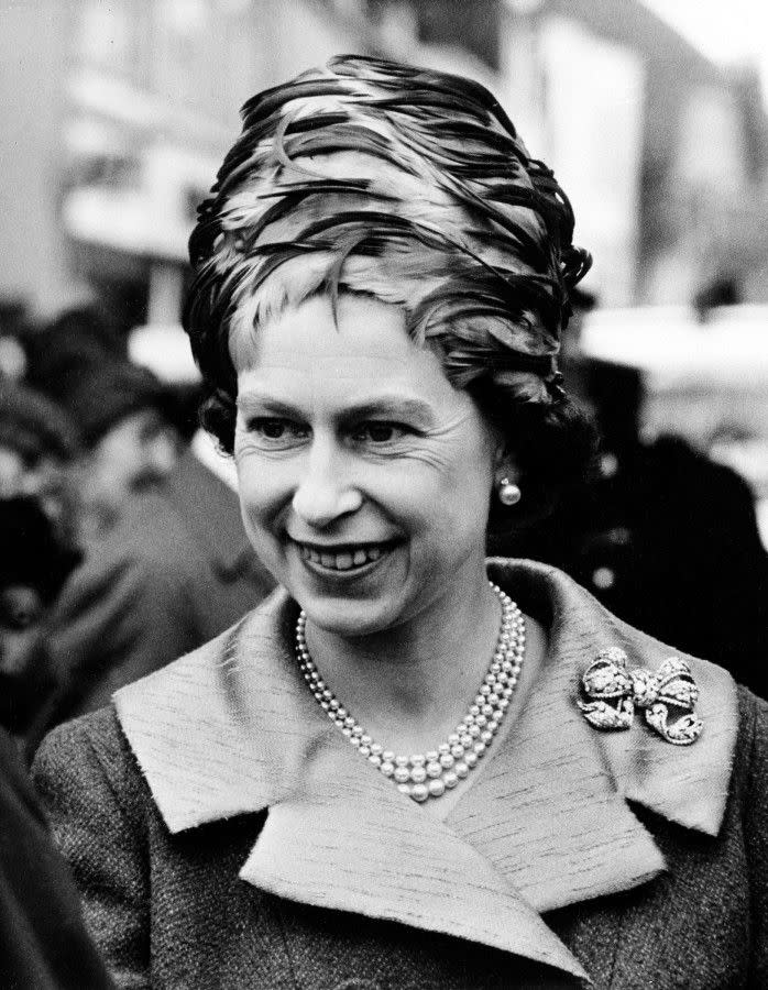 Hats off, your majesty! Queen Elizabeth, 38, wears a feathered topper to the Royal Maundy ceremony in Canterbury Cathedral in Canterbury, England, on April 15, 1965.