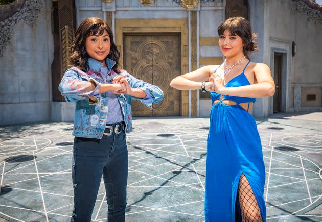 Actor Xochitl Gomez, right, poses with her comic counterpart, America Chavez, left, during a visit to Avengers Campus at Disney's California Adventure Park. (Photo: Christian Thompson/Disney Resorts via Getty Images)