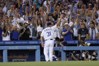 Los Angeles Dodgers starting pitcher Max Scherzer takes a curtain call during the seventh inning of a baseball game against the Houston Astros in Los Angeles, Wednesday, Aug. 4, 2021. Scherzer threw 109 pitches, and struck out ten Astro batters. (AP Photo/Alex Gallardo)