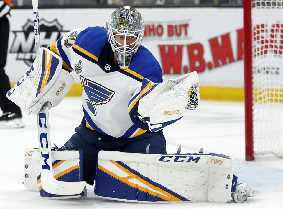 St. Louis Blues goaltender Jordan Binnington catches the puck to make a save against the Boston Bruins during the second period in Game 7 of the NHL hockey Stanley Cup Final, Wednesday, June 12, 2019, in Boston. (AP Photo/Michael Dwyer)