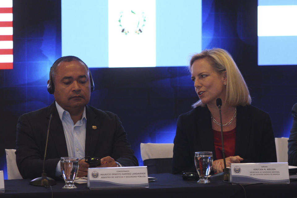 U.S. Secretary of Homeland Security Kirstjen Nielsen, right, talks to El Salvador Minister of Justice and Public Security Mauricio Ramirez Landaverde at the start of a meeting on migration and security issues between Nielsen and government ministers from Honduras, Guatemala, and El Salvador, in San Salvador, El Salvador, Wednesday, Feb. 20, 2019. (AP Photo/Salvador Melendez)