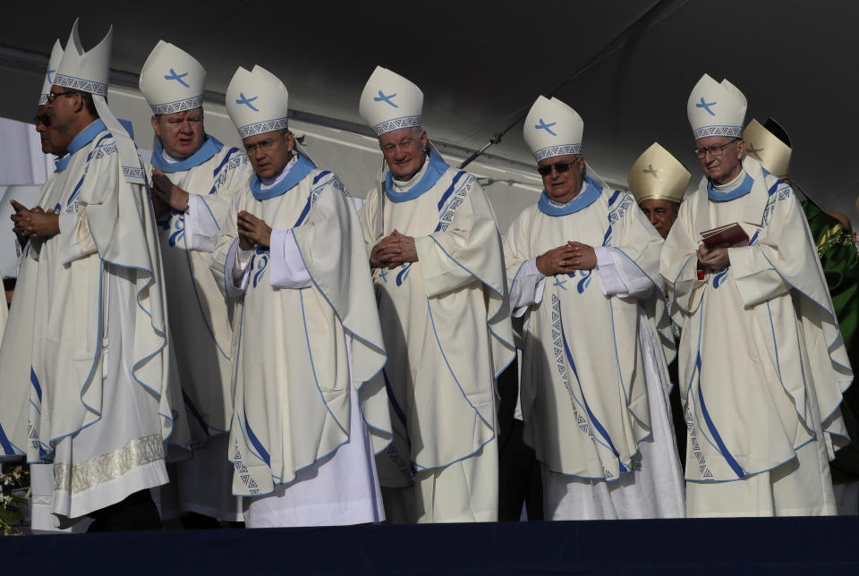 Cardinals arrive for an early morning Mass celebrated by Pope Francis at the metro park Campo San Juan Pablo II in Panama City, Sunday, Jan. 27, 2019. The Mass marks the formal end to World Youth Day, the once-every-three year religious festival that John Paul launched during his quarter-century pontificate. (AP Photo/Alessandra Tarantino)