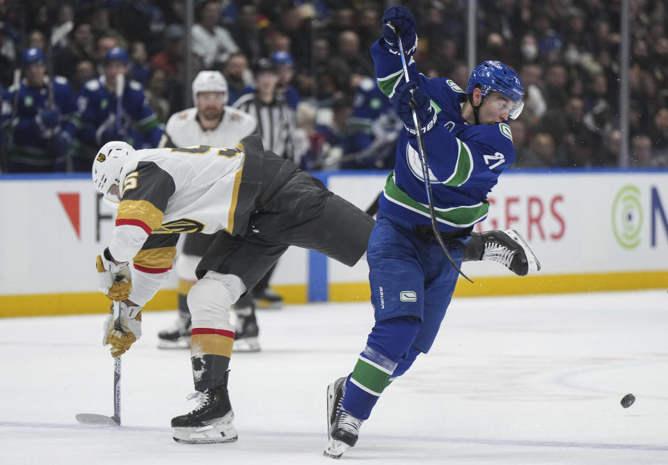 Vancouver Canucks' Nils Hoglander, right, avoids a collision with Vegas Golden Knights' Keegan Kolesar during the first period of an NHL hockey game Thursday, Nov 30, 2023, in Vancouver, British Columbia. (Darryl Dyck/The Canadian Press via AP)