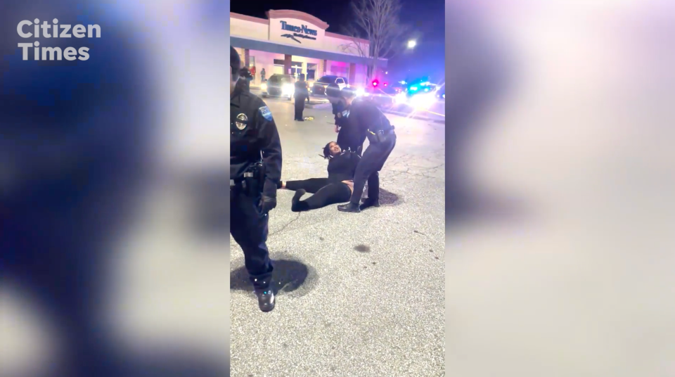 Patricia King cries out in despair while in handcuffs in the parking lot near her son's body after he was shot in Hendersonville.