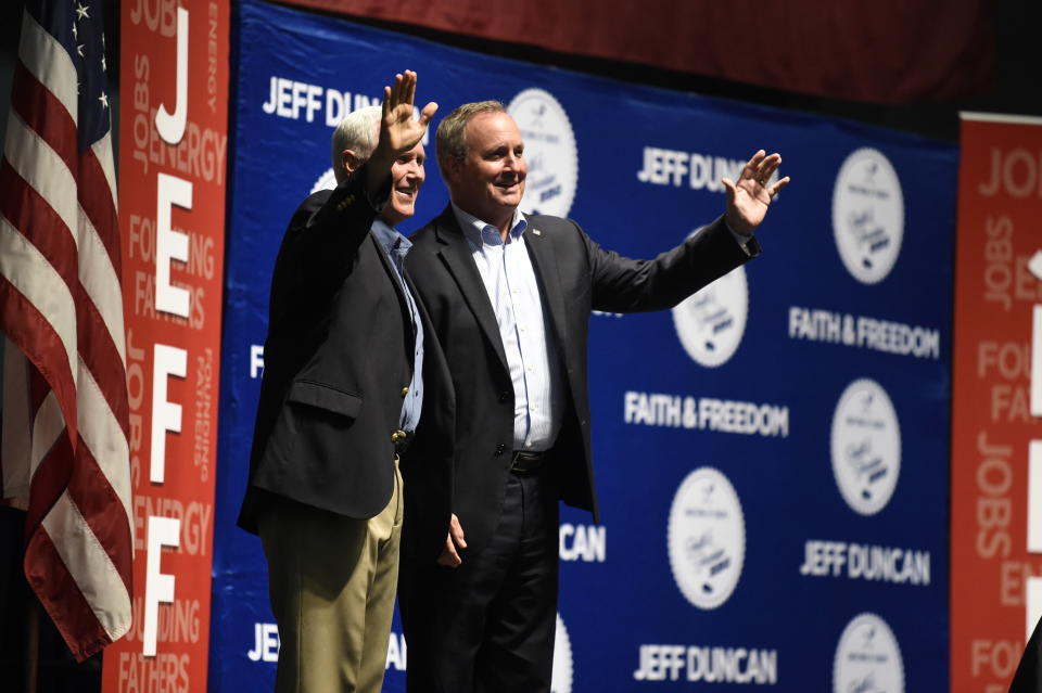 Vice President Mike Pence, left, stands next to U.S. Rep. Jeff Duncan on stage, Monday, Aug. 26, 2019, in Anderson, S.C. Pence was the headlining speaker at an annual fundraiser hosted by Duncan. (AP Photo/Meg Kinnard)