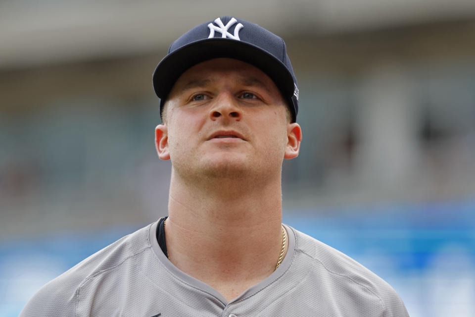 New York Yankees starting pitcher Clarke Schmidt walks off the field after throwing to the Minnesota Twins in the sixth inning of a baseball game Thursday, May 16, 2024, in Minneapolis. The Yankees beat the Twins 5-0. (AP Photo/Bruce Kluckhohn)