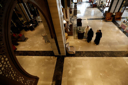 Muslims visitors walk in the Al Meroz hotel in Bangkok, Thailand, August 29, 2016. REUTERS/Chaiwat Subprasom