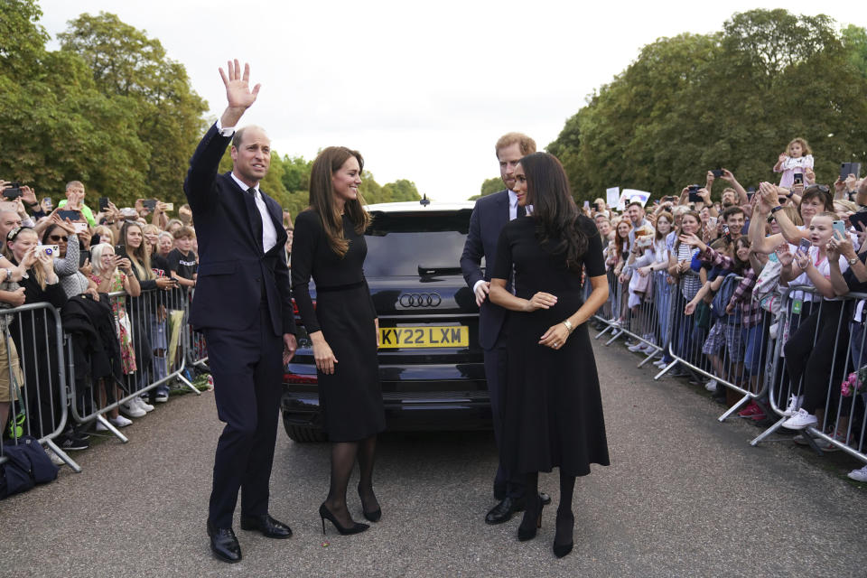 FILE - From left, Britain's Prince William, Prince of Wales, Kate, Princess of Wales, Prince Harry and Meghan, Duchess of Sussex meet members of the public at Windsor Castle, following the death of Queen Elizabeth II on Thursday, in Windsor, England, Saturday, Sept. 10, 2022. Prince Harry has said he wants to have his father and brother back and that he wants “a family, not an institution,” during a TV interview ahead of the publication of his memoir. The interview with Britain’s ITV channel is due to be released this Sunday. (Kirsty O'Connor/Pool Photo via AP, Fil)