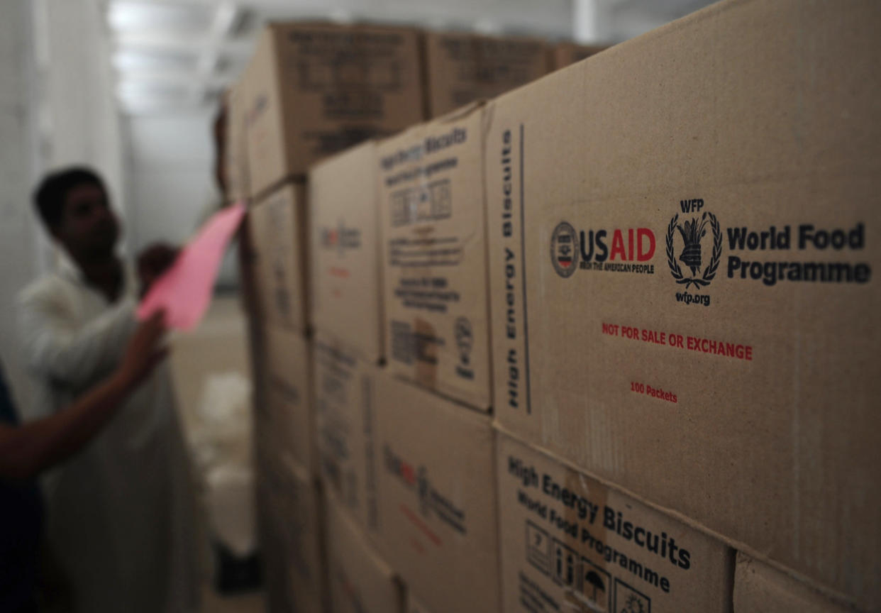 A&nbsp;Pakistani worker arranges aid supplies at a supply centre in the Jacobabad district in 2012. The president's spending plan&nbsp;eliminates funding for key U.S. foreign&nbsp;food aid programs. (Photo: Credit: Rizwan Tabassum/AFP/Getty Images)