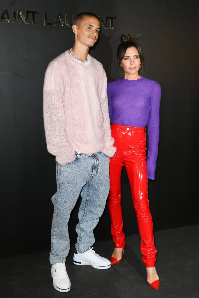 Victoria and Romeo Beckham attend the Saint Laurent Fall 2022 fashion show at Paris Fashion Week on March 1, 2022. - Credit: KCS Presse / MEGA