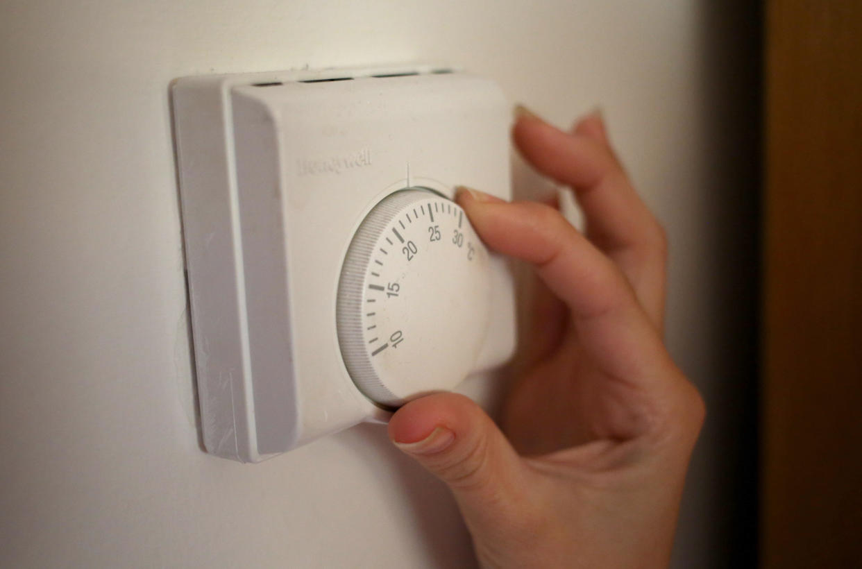 Undated file photo of a person using a central heating thermostat. Britons could see their energy bills rise by 30% next year, analysts have said. Research agency Cornwall Insight has predicted further volatile gas prices and the potential collapse of even more suppliers could push the energy price cap to about �1,660 in summer. Issue date: Thursday October 7, 2021.
