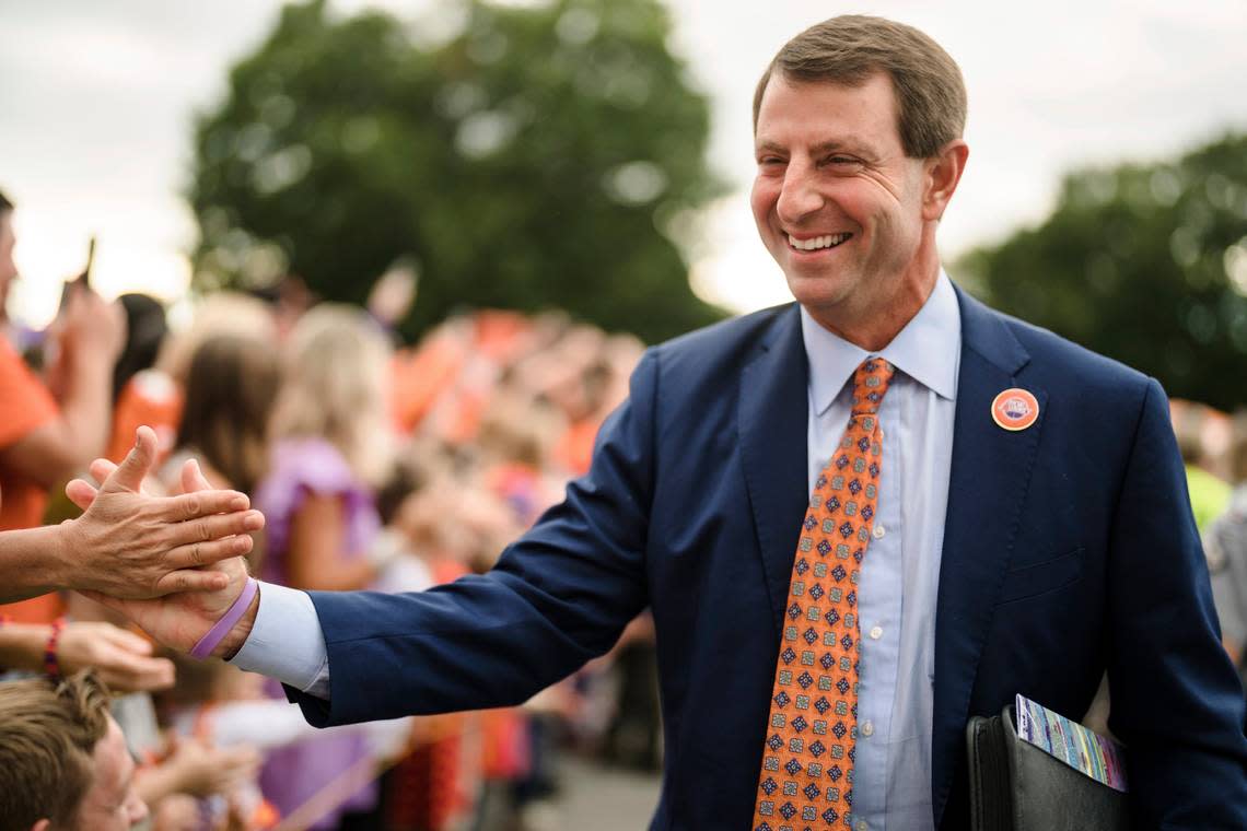 Clemson head coach Dabo Swinney greets fans as he walks toward the stadium before an NCAA college football game against North Carolina State, Saturday, Oct. 1, 2022, in Clemson, S.C.