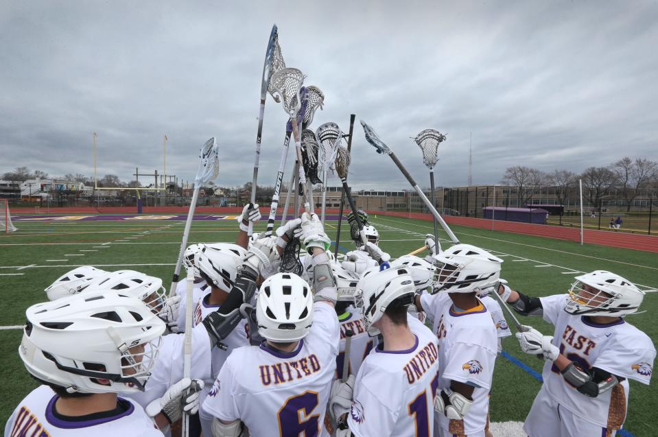 The East United Eagles gather together for a pre-game rally talk before taking on Aquinas during their game at East High School Wednesday, April 18, 2018.   East United is the first varsity lacrosse team based in the City of Rochester. 