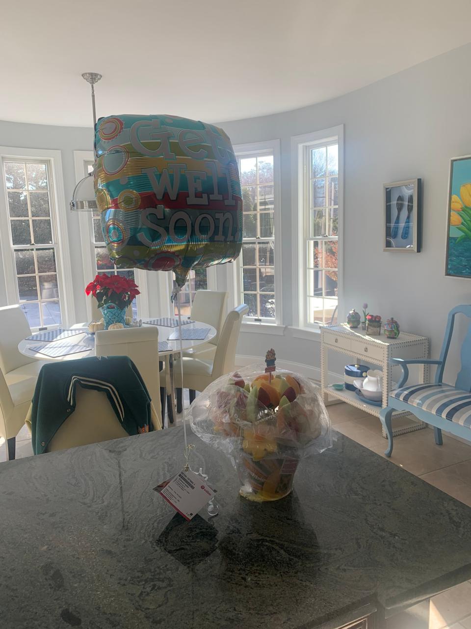Edward Adler's “get well soon” balloon and the Edible Arrangements. in Southampton, New York, in December 2021.