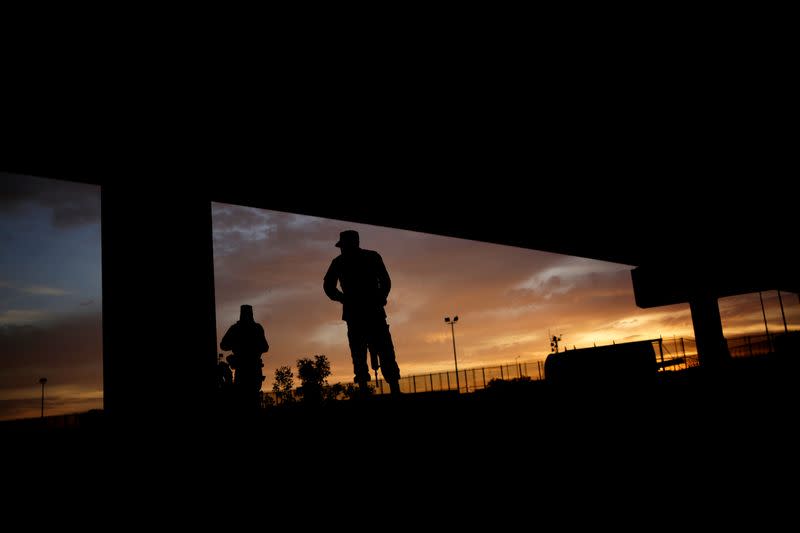 FILE PHOTO: Members of the Mexican National Guard stand near the border fence between Mexico and the U.S. in Ciudad Juarez