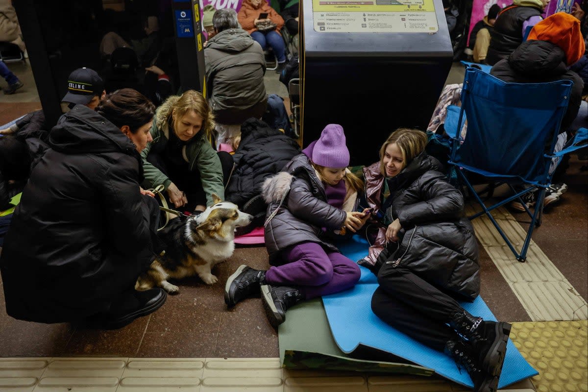 People take shelter inside a metro station in Kyiv on 21 March (Reuters)